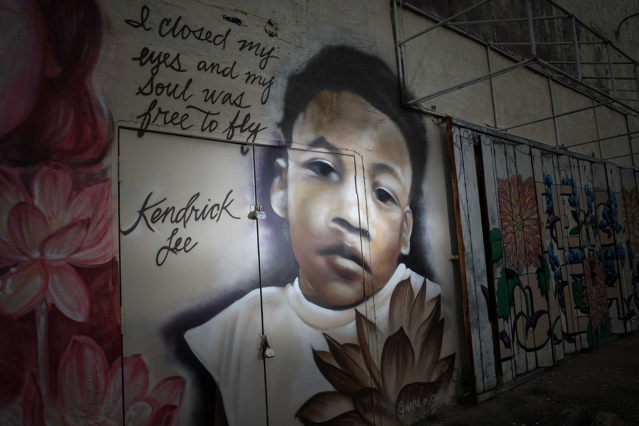 A mural shows Kendrick Lee, photographed Wednesday, Nov. 24, 2021, at the intersection of Elgin Street and Ennis Street in the Third Ward neighborhood in Houston. Officials allege that Lee was beaten to death and left in an apartment with his abandoned siblings for months.